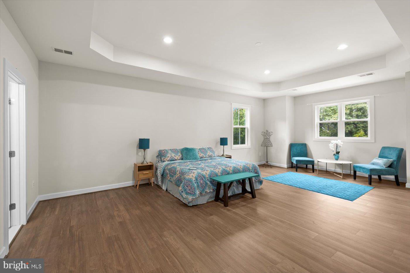 537 Monticello Circle Locust Grove, VA 22508 - Photo 42 of 107 a spacious bedroom with a bed and wooden floor