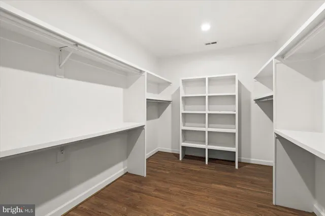 a view of a yard with swimming pool and trees in the background