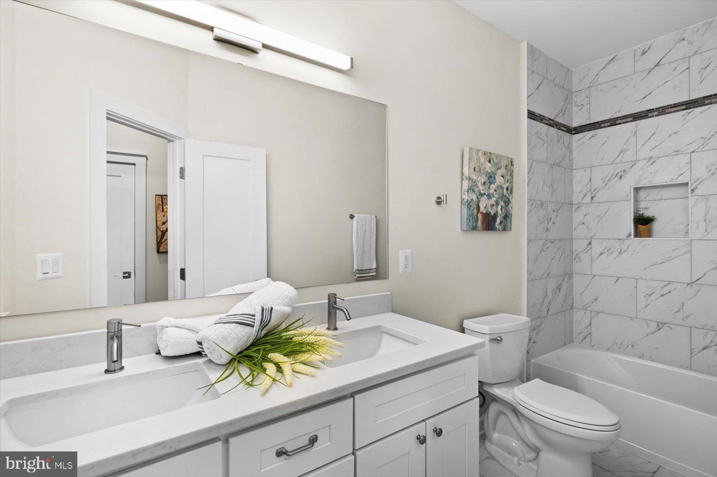 537 Monticello Circle Locust Grove, VA 22508 - Photo 54 of 107 a bathroom with a granite countertop sink a toilet and shower