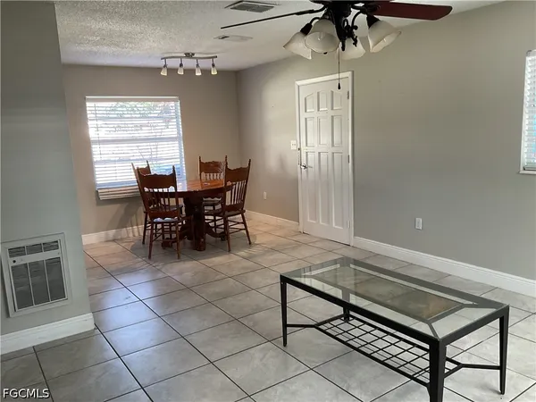 a view of a livingroom with furniture and window