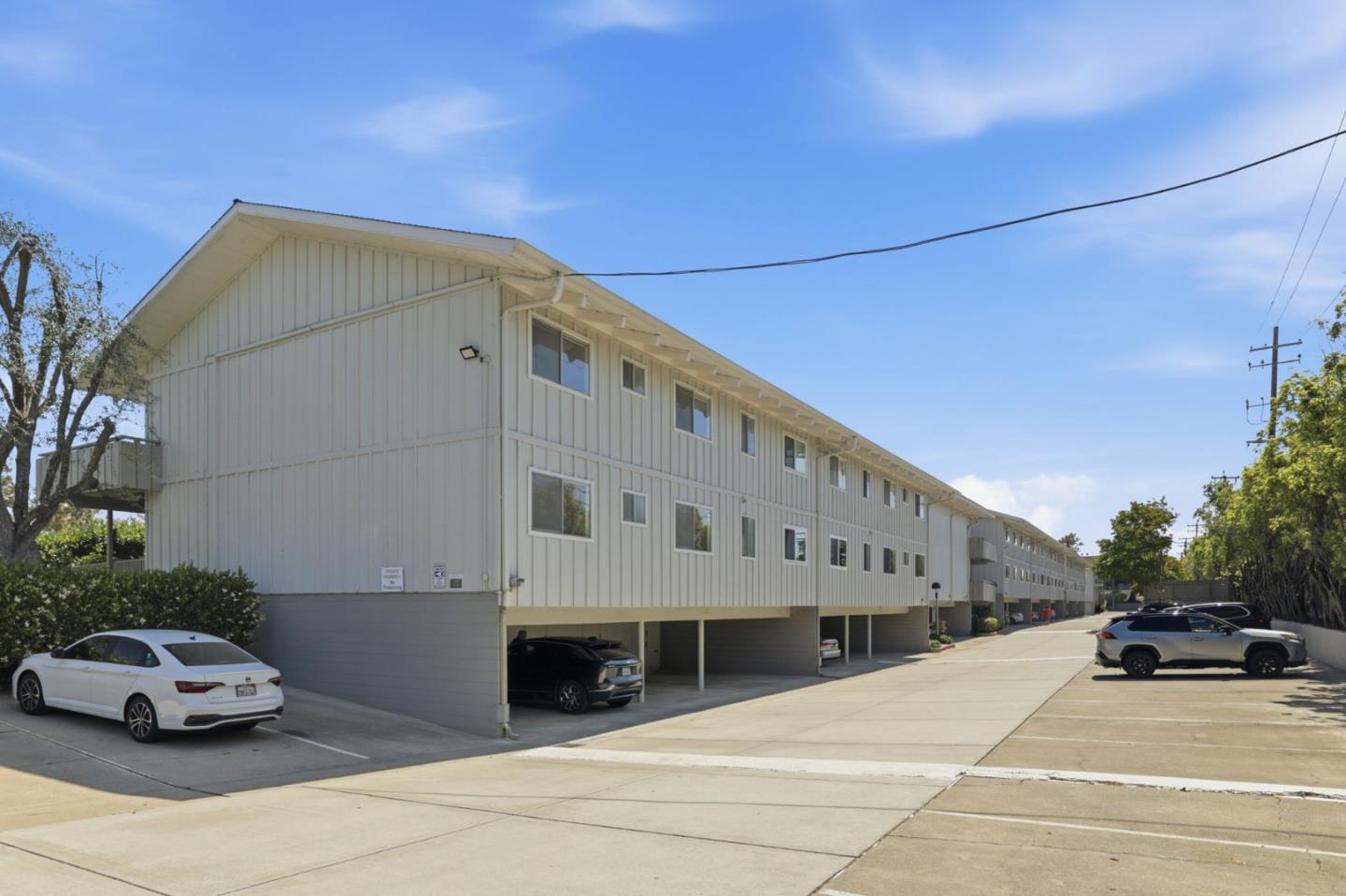 255 South Rengstorff Avenue, Unit 2 Mountain View, CA 94040 - Photo 24 of 25 a car parked in front of a building