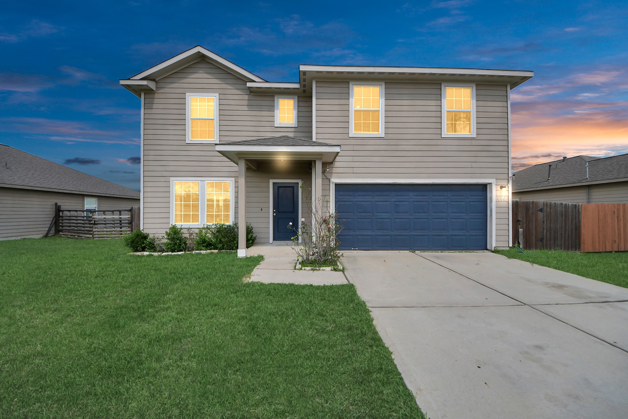 a front view of a house with a yard