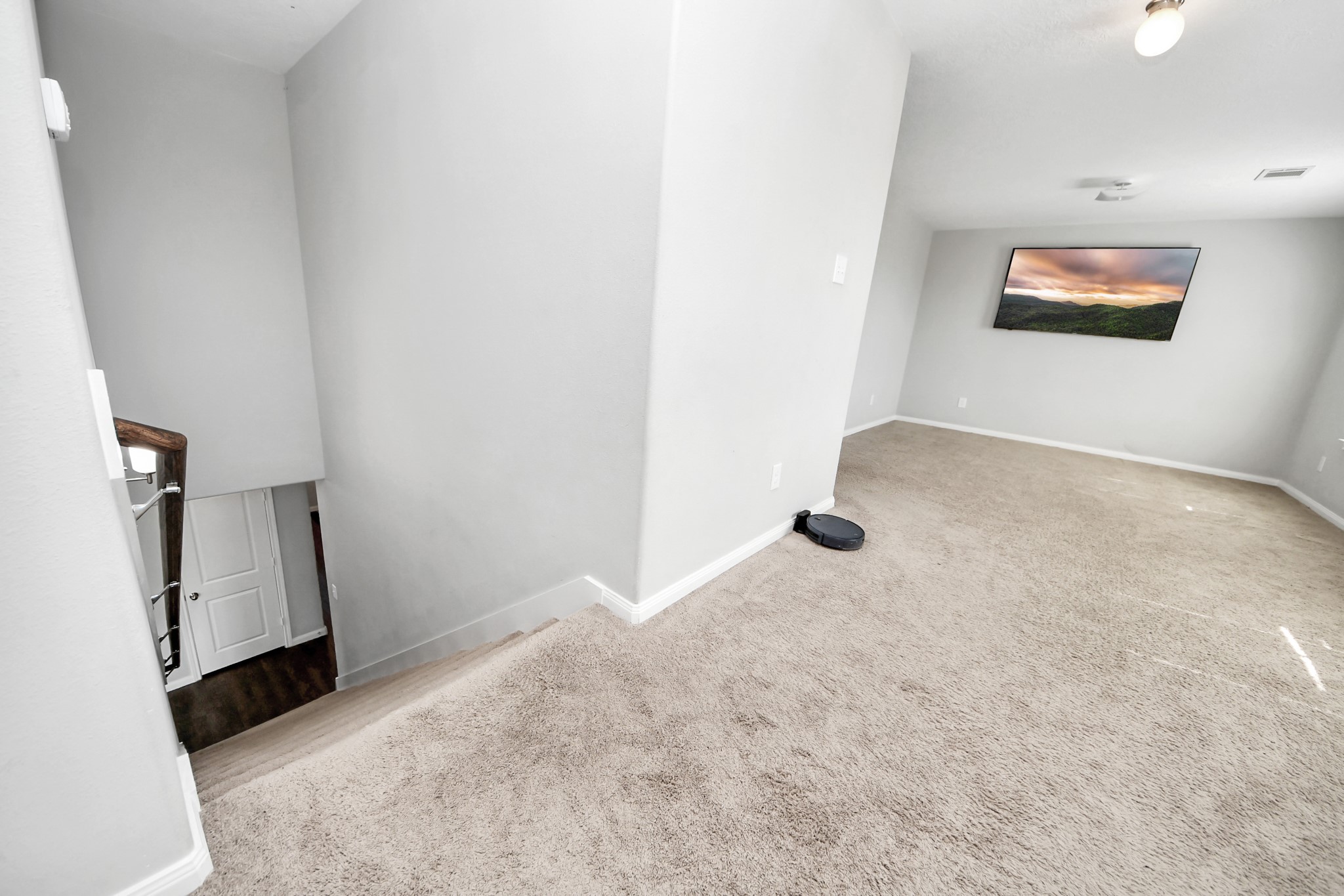 696 Road 5105 Cleveland, TX 77327 - Photo 11 of 25 a view of a livingroom with wooden floor and staircase