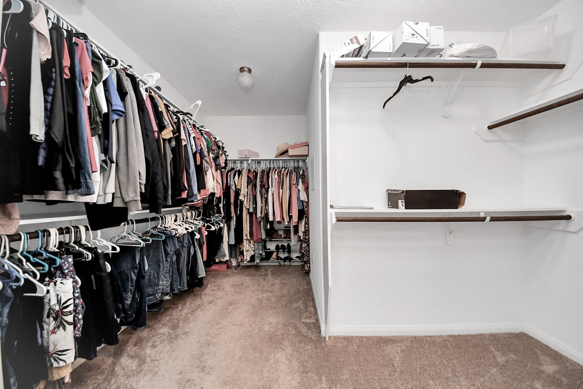 696 Road 5105 Cleveland, TX 77327 - Photo 15 of 25 a view of walk in closet with clothes and shoes