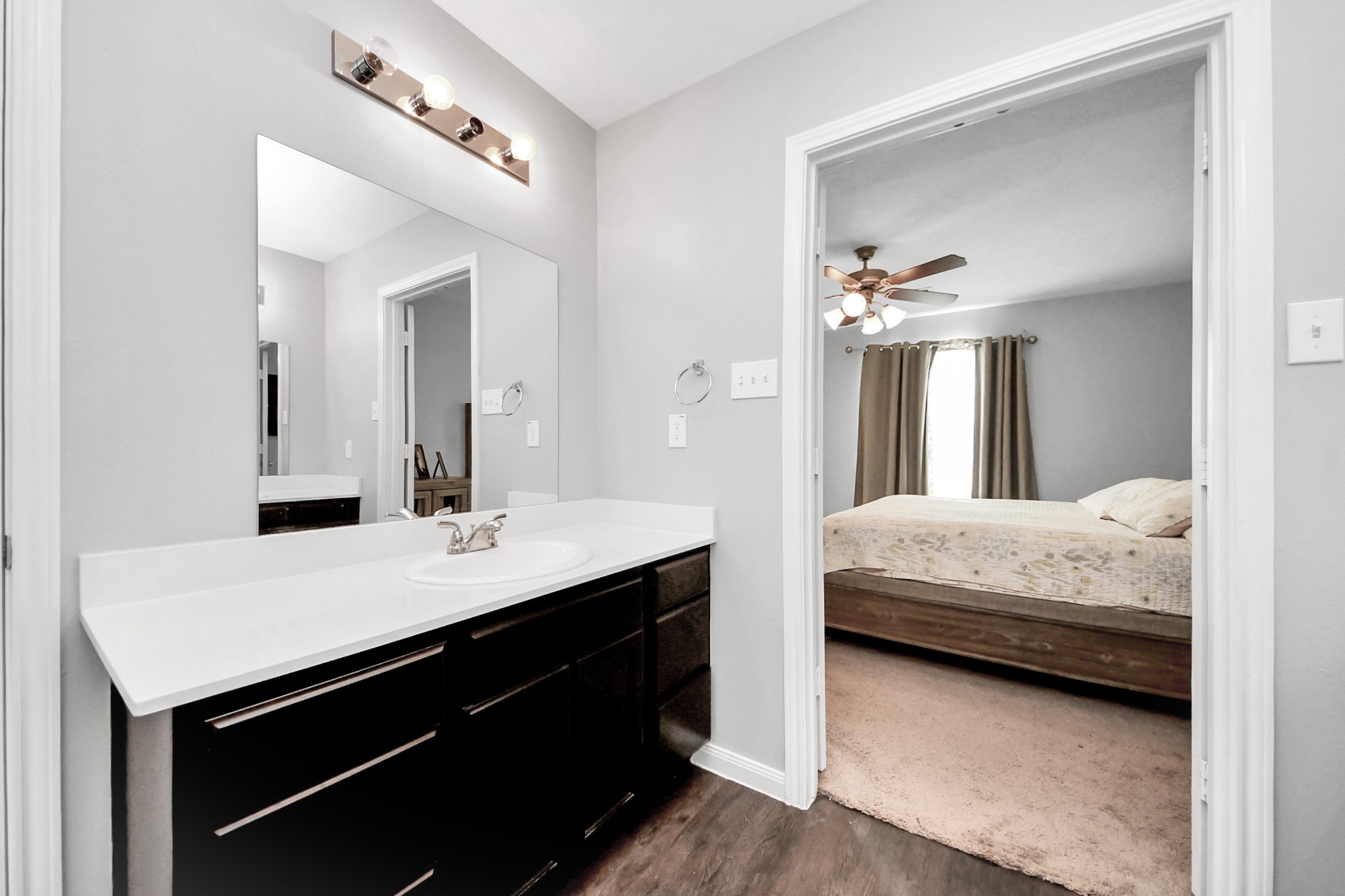 696 Road 5105 Cleveland, TX 77327 - Photo 16 of 25 a en suite bathroom with a double vanity sink and a mirror