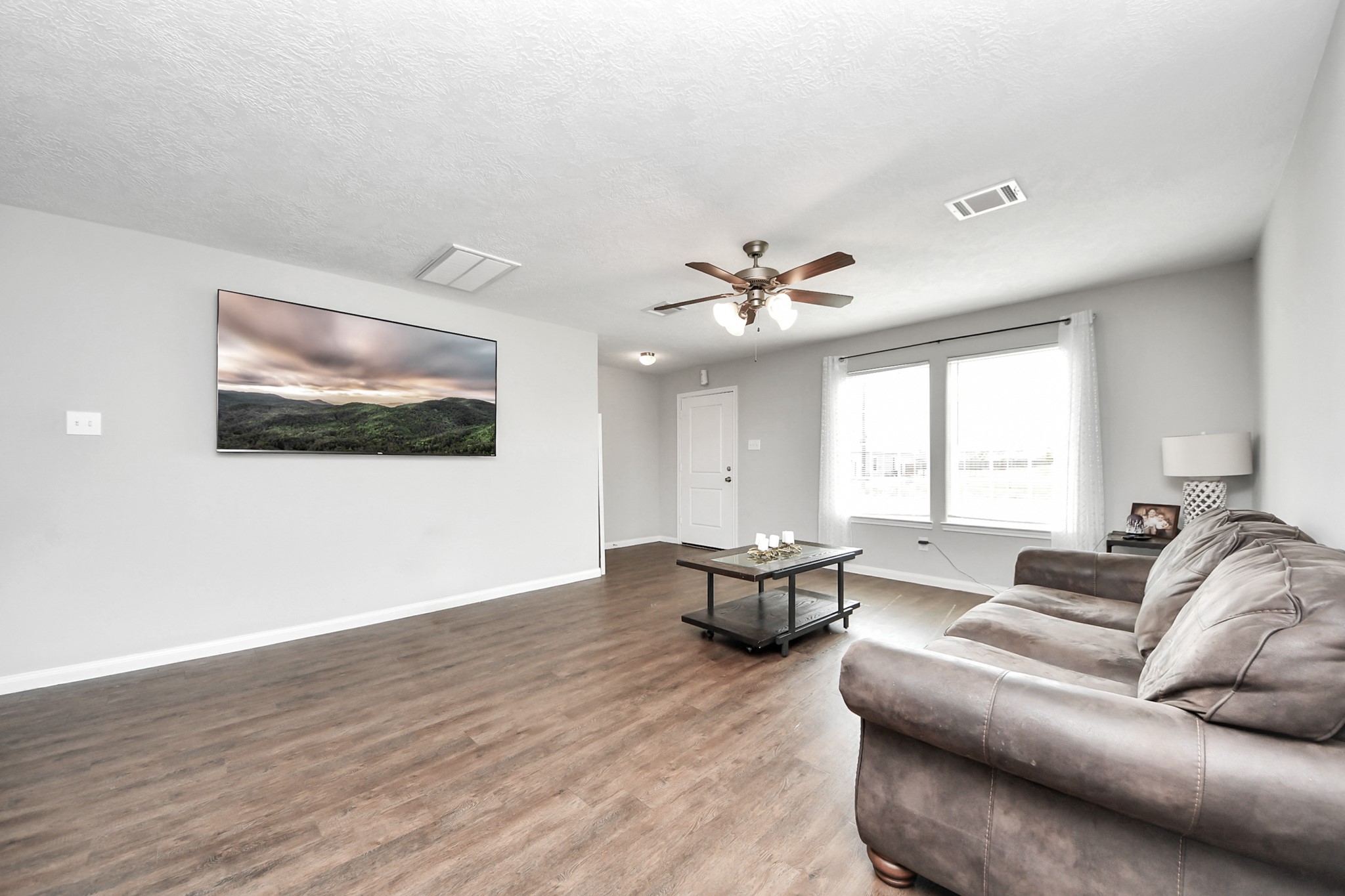 696 Road 5105 Cleveland, TX 77327 - Photo 4 of 25 a living room with furniture and a large window