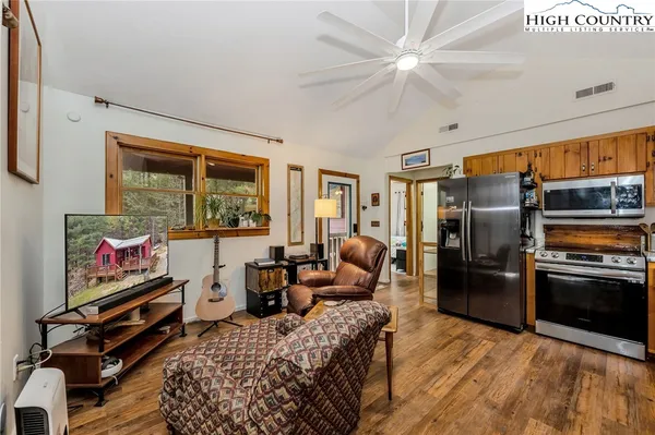 a bed room with a bed and a tv