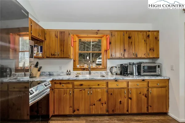 a bedroom with a bed and hallway