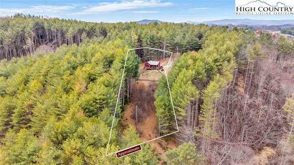 a view of a patio with a table and chairs
