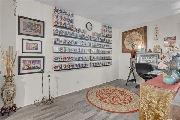 a kitchen with stainless steel appliances granite countertop a stove a sink dishwasher and cabinets with wooden floor