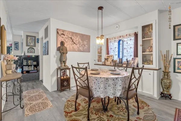 a kitchen with a table and chairs