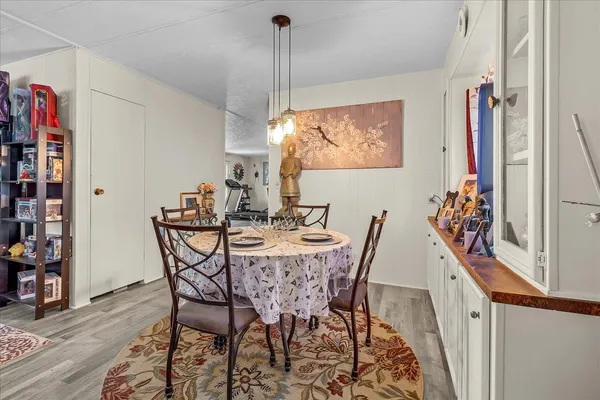 a kitchen with granite countertop a sink stove and cabinets