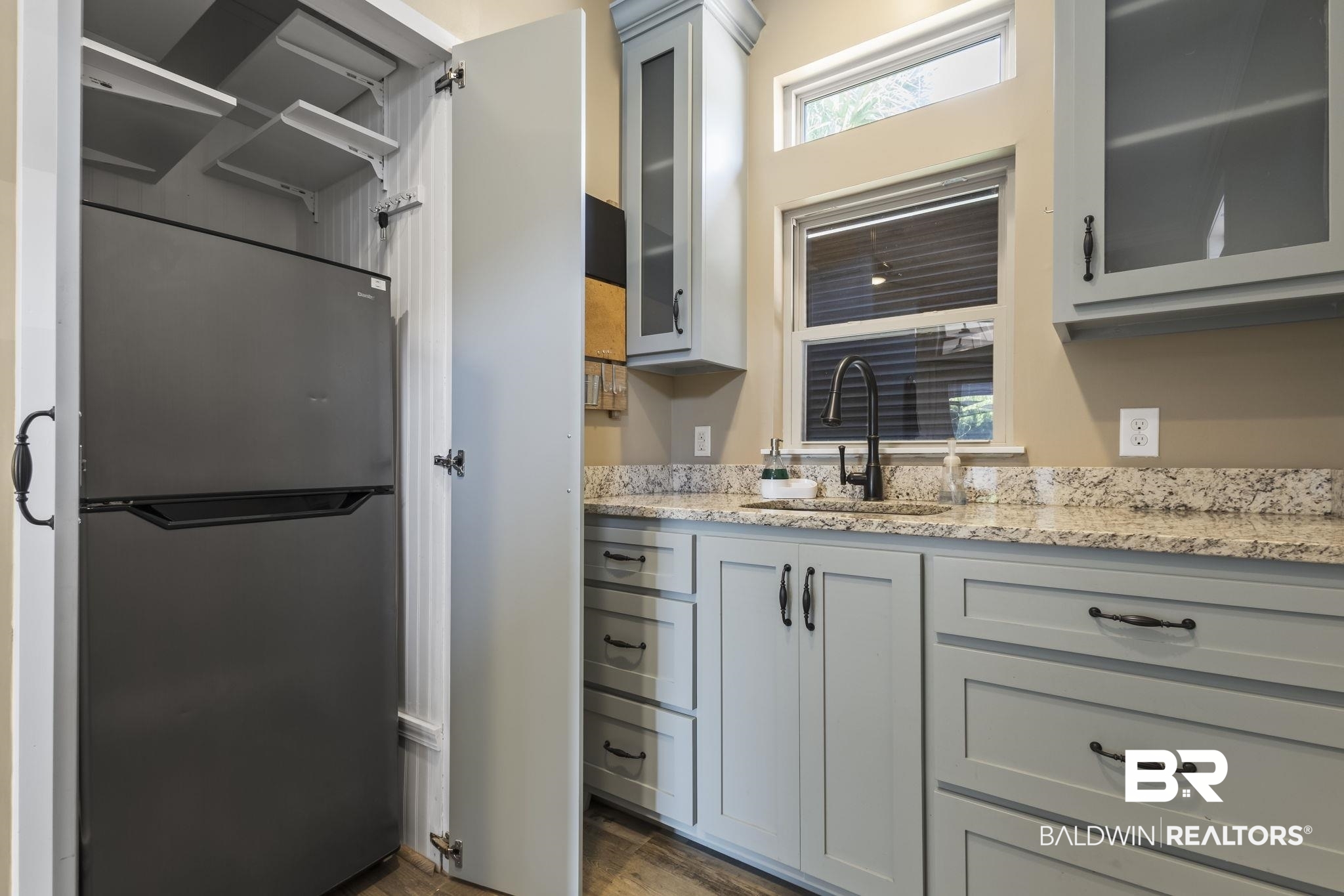 212 Magnifico Drive Foley, AL 36535 - Photo 26 of 50 Kitchen with gray cabinetry, stainless steel refrigerator, light stone countertops, dark hardwood / wood-style flooring, and sink