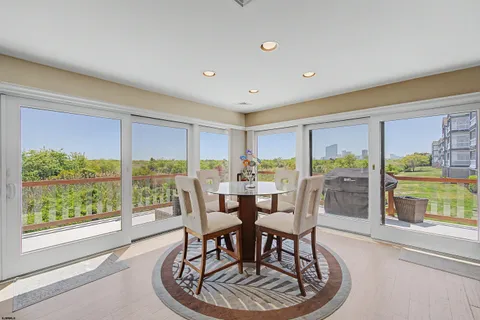 a dining room with furniture window and outside view