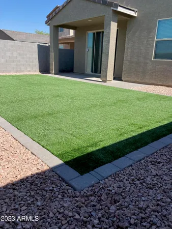 a view of a backyard of the house
