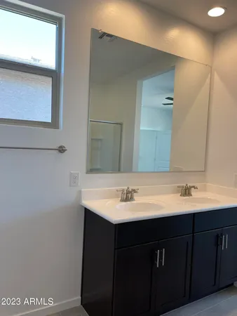 a bathroom with a glass shower door