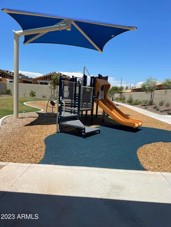a view of a swimming pool with a yard