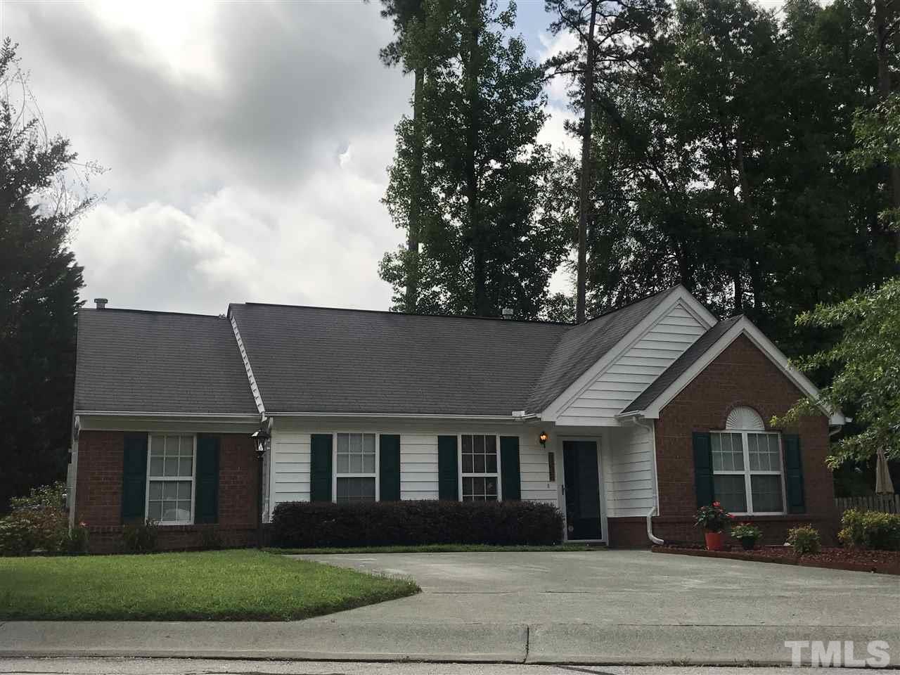 6007 Newhall Road Durham, NC 27713 - Photo 2 of 25 a front view of a house with a garden