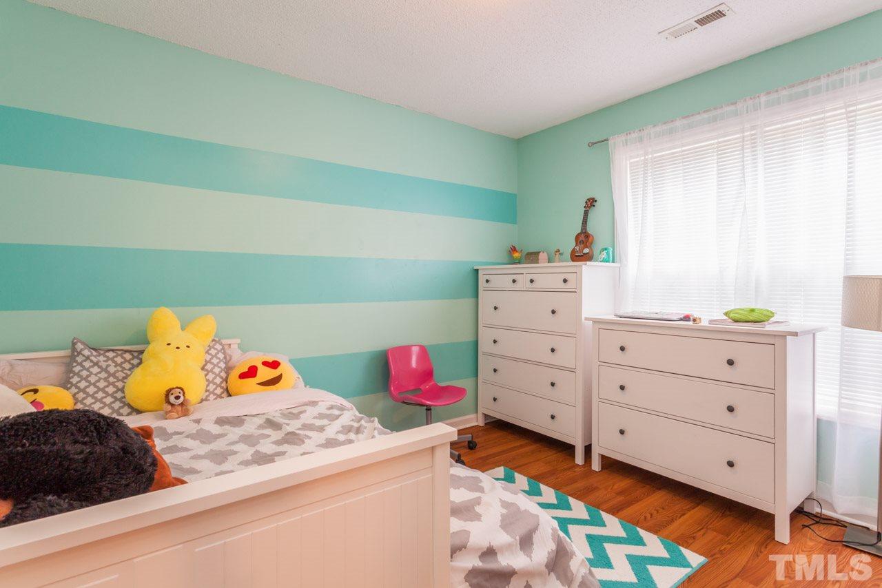 6007 Newhall Road Durham, NC 27713 - Photo 16 of 25 a bedroom with a bed and a dresser
