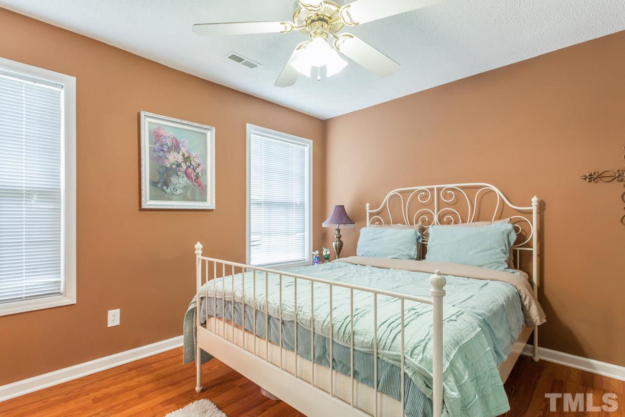 6007 Newhall Road Durham, NC 27713 - Photo 18 of 25 a bedroom with a bed and a window
