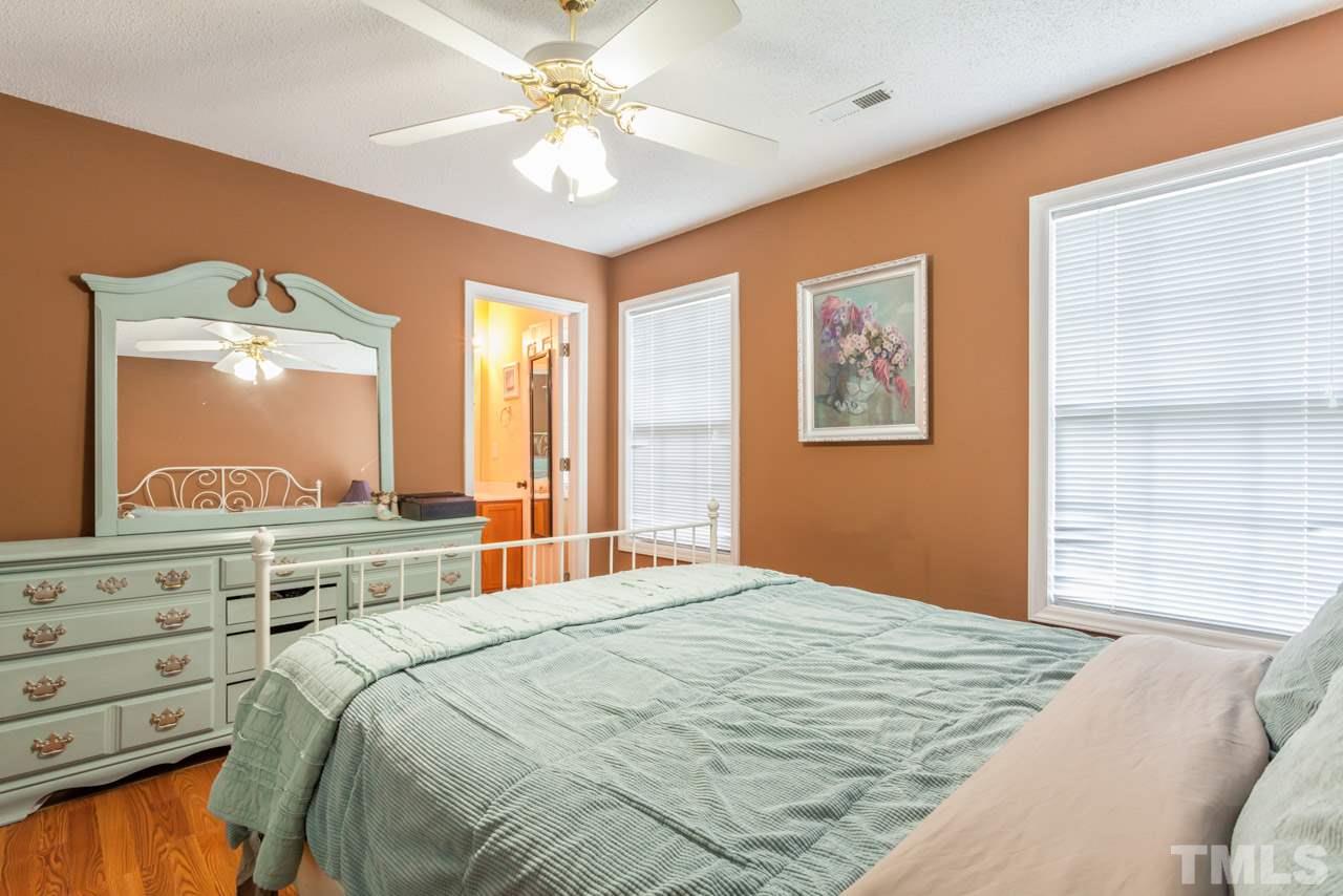 6007 Newhall Road Durham, NC 27713 - Photo 19 of 25 a bedroom with a large bed and a window