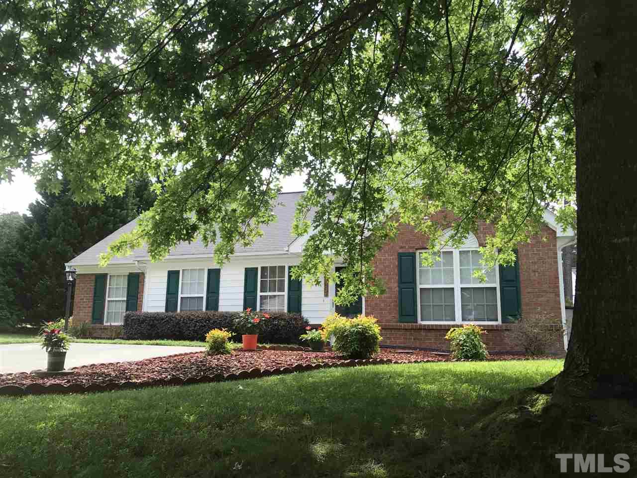 6007 Newhall Road Durham, NC 27713 - Photo 3 of 25 a front view of house with yard and green space