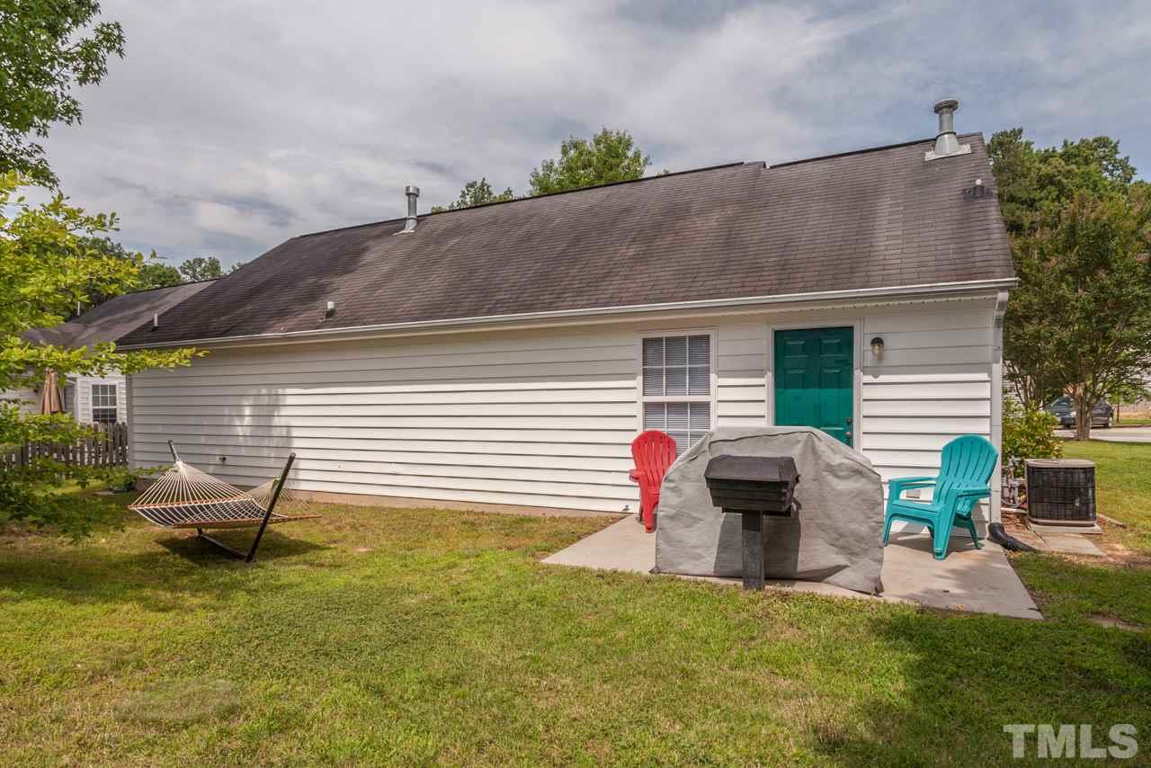 6007 Newhall Road Durham, NC 27713 - Photo 21 of 25 a backyard of a house with seating space