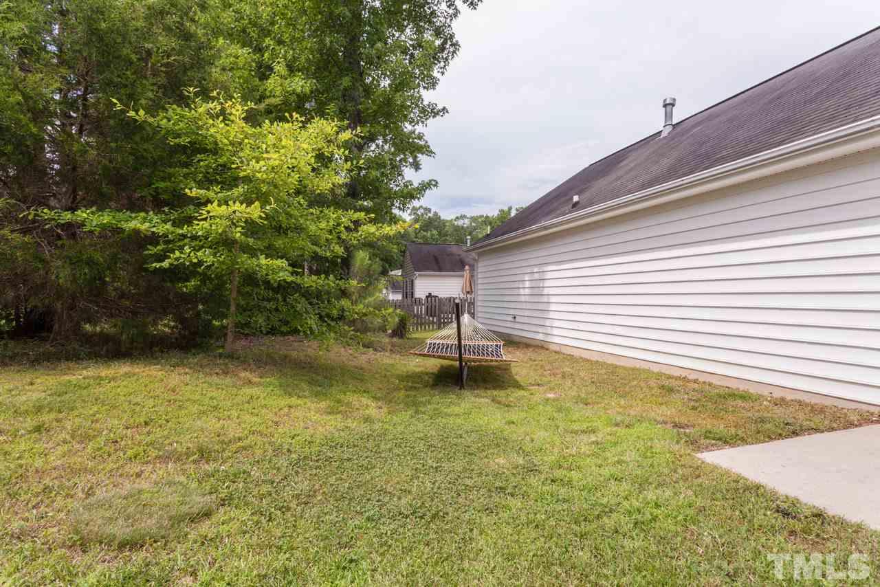 6007 Newhall Road Durham, NC 27713 - Photo 24 of 25 a swimming pool with wooden fence
