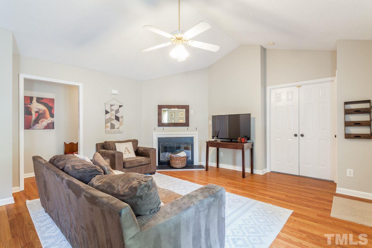 6007 Newhall Road Durham, NC 27713 - Photo 6 of 25 a living room with furniture and a flat screen tv