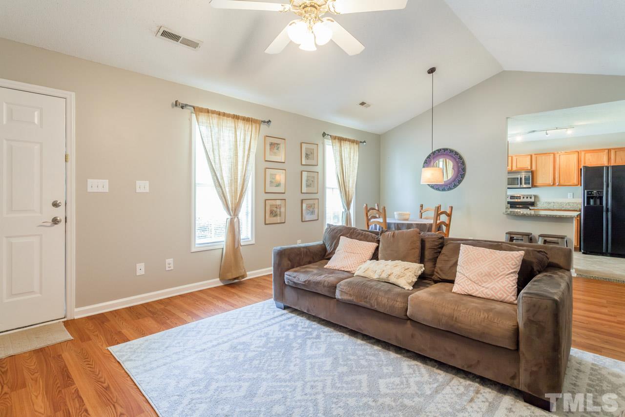 6007 Newhall Road Durham, NC 27713 - Photo 7 of 25 a living room with furniture and a large window