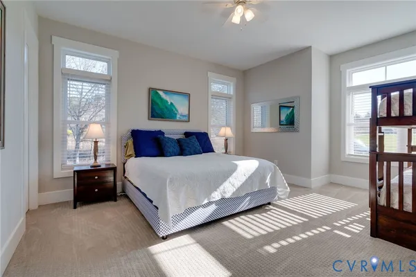 a bathroom with a tub a sink and a mirror