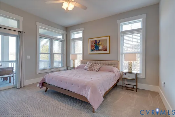 a spacious bedroom with a bed and a window