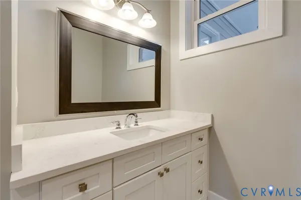 a view of a hallway with wooden floor and entryway