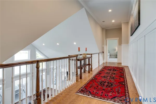 a living room with fireplace furniture and a wooden floor