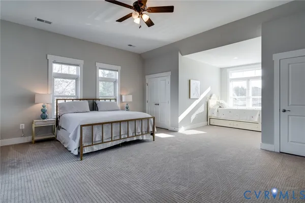 a living room with furniture a dining table and a dining table with wooden floor
