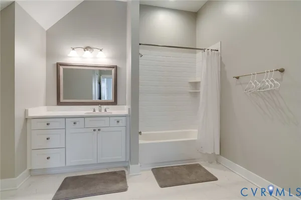 a bedroom with a bed and a fireplace