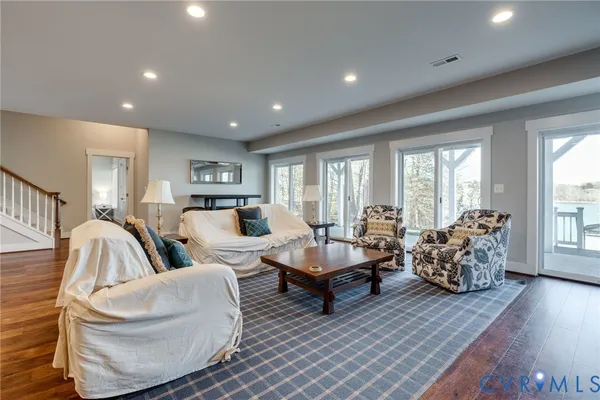 a view of a house with many windows and a yard