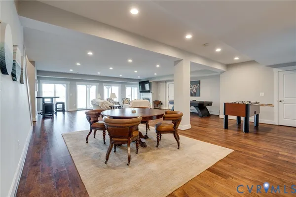 a view of a big house with a big yard and large trees
