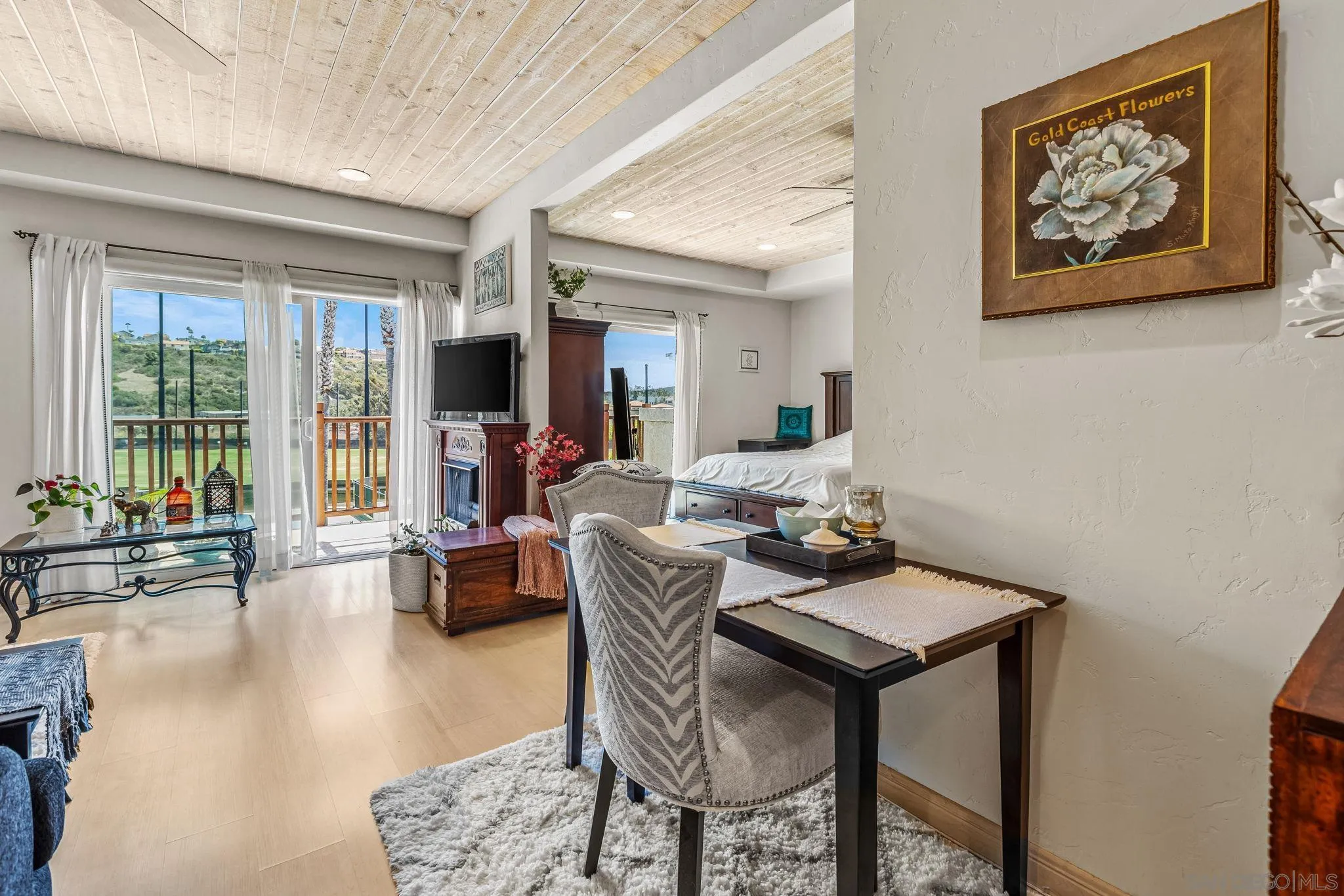 2003 Costa Del Mar Road, Unit 692 Carlsbad, CA 92009 - Photo 1 of 42 a living room with furniture and a large window