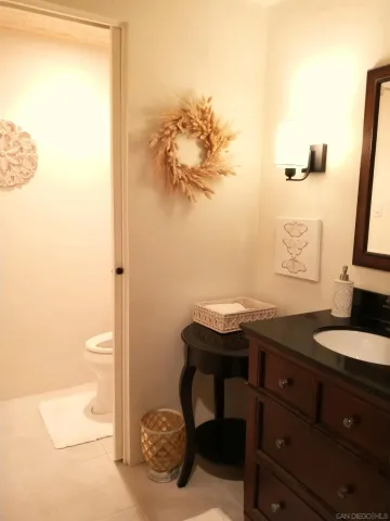 a bedroom with a bed and a flat screen television