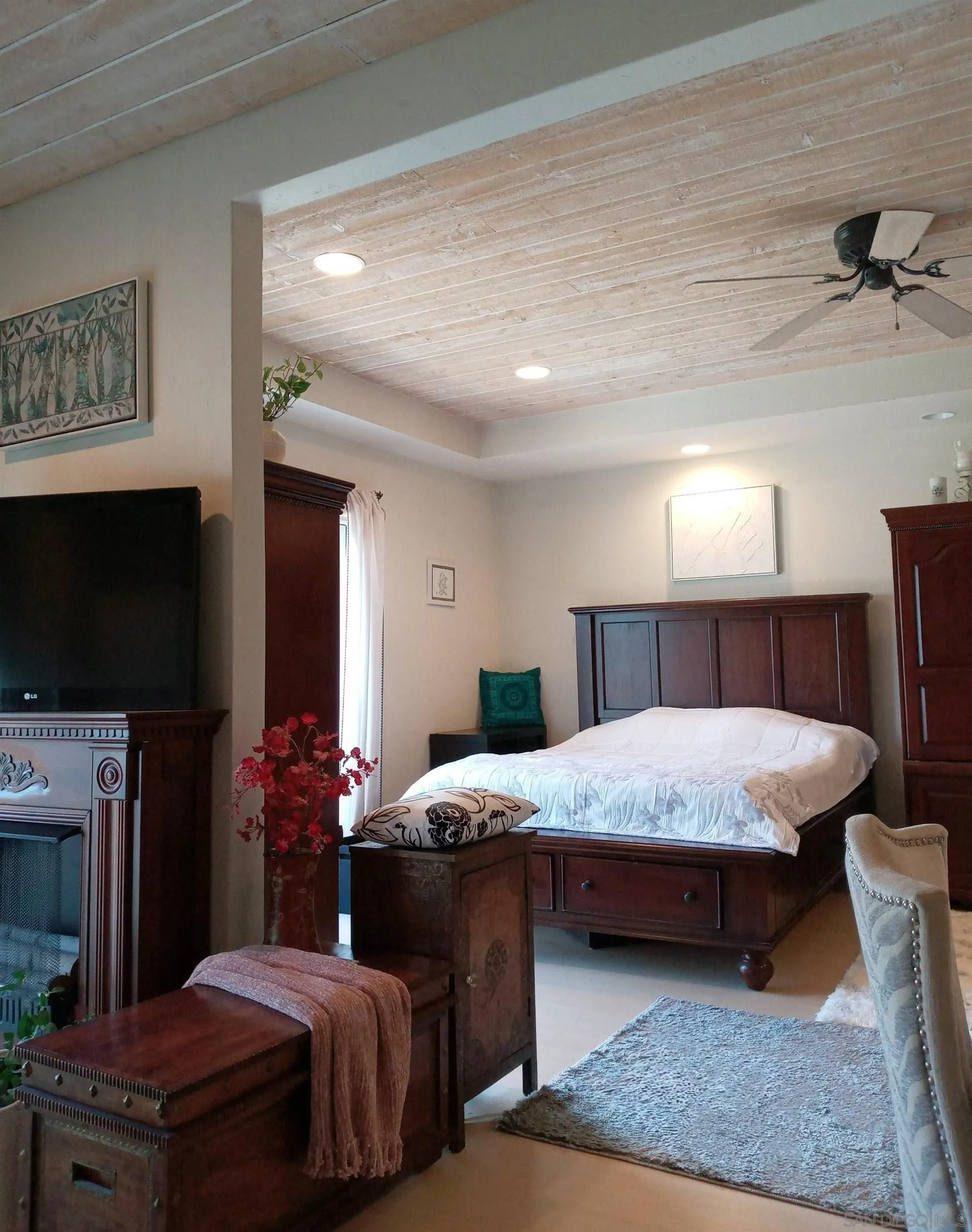 2003 Costa Del Mar Road, Unit 692 Carlsbad, CA 92009 - Photo 16 of 42 a bedroom with a bed and a flat screen television