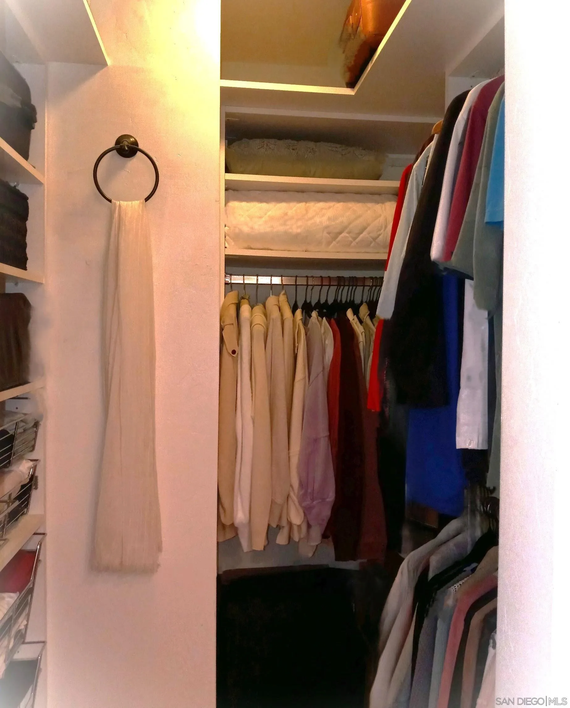 2003 Costa Del Mar Road, Unit 692 Carlsbad, CA 92009 - Photo 19 of 42 a view of walk in closet with clothes and shoes