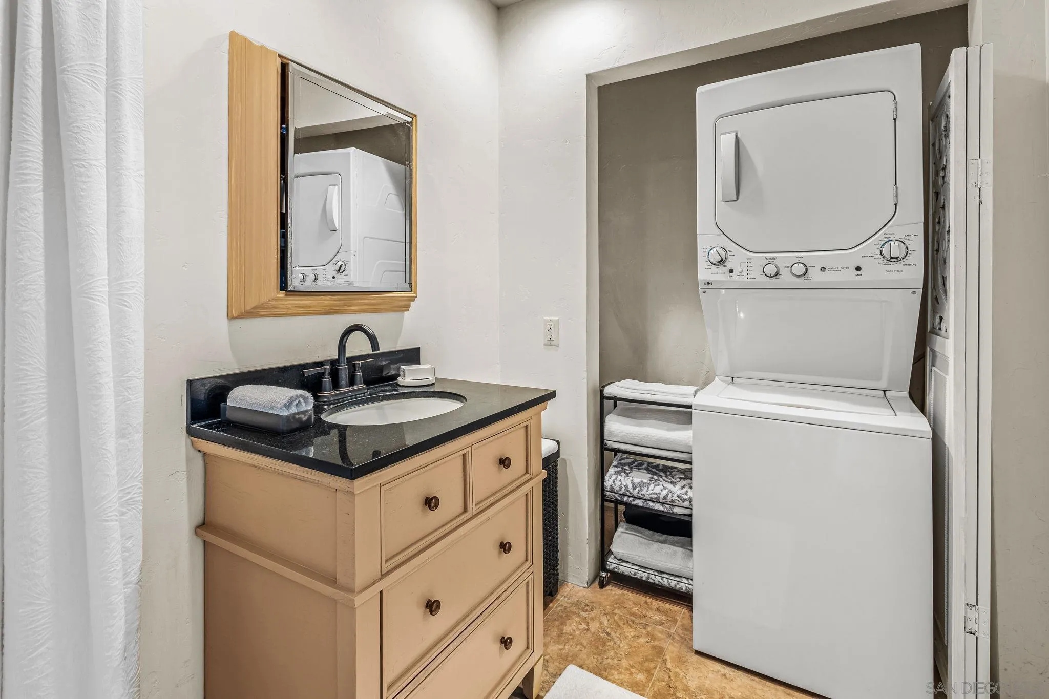 2003 Costa Del Mar Road, Unit 692 Carlsbad, CA 92009 - Photo 21 of 42 a bathroom with a sink and a mirror