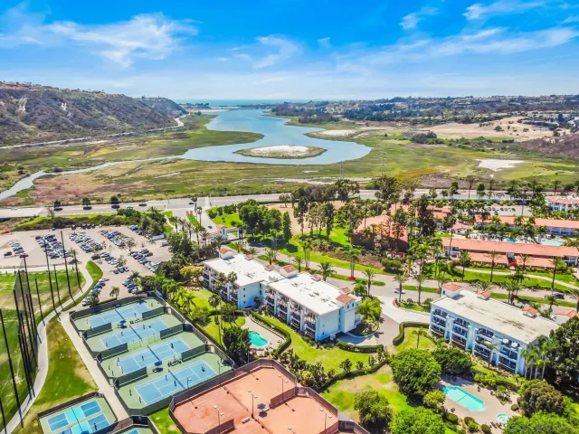 a sign that is sitting on a brick wall