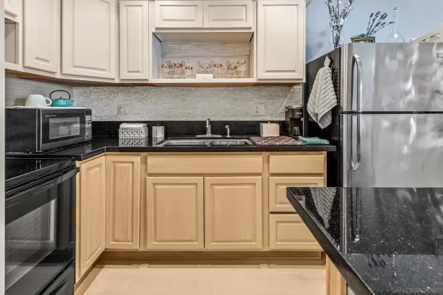 a kitchen with appliances cabinets and a counter top