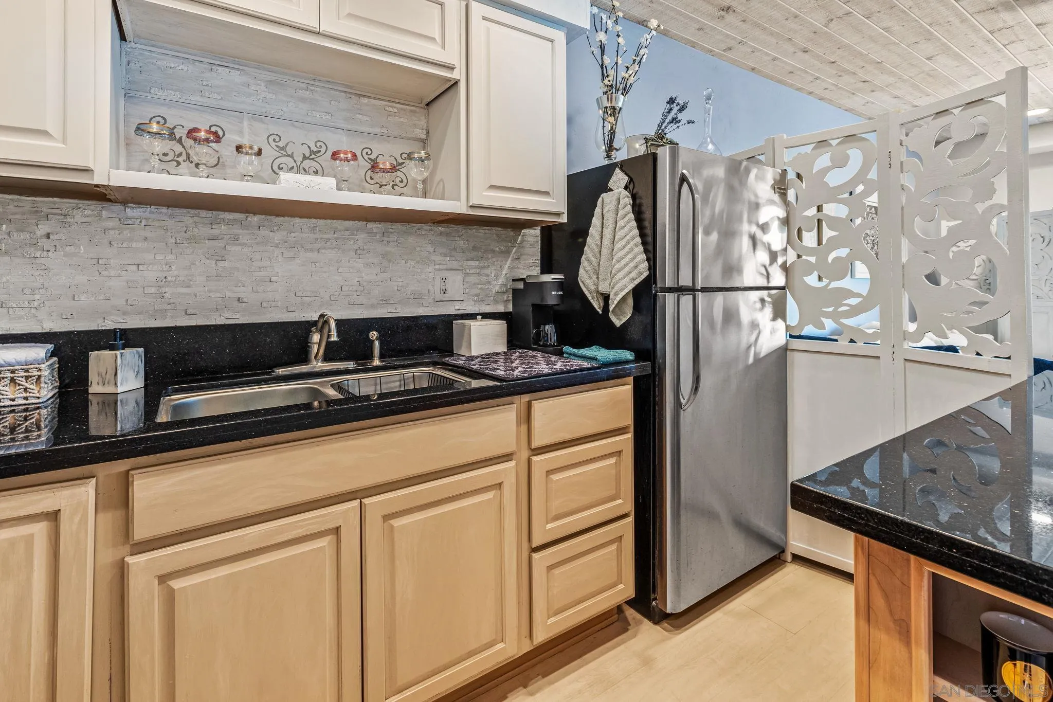 2003 Costa Del Mar Road, Unit 692 Carlsbad, CA 92009 - Photo 7 of 42 a kitchen with appliances cabinets and a counter top