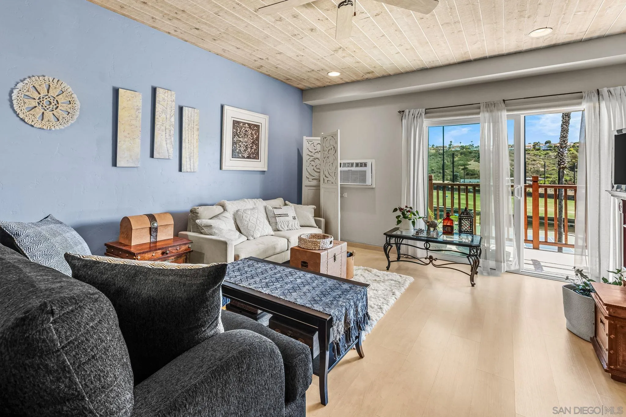 2003 Costa Del Mar Road, Unit 692 Carlsbad, CA 92009 - Photo 10 of 42 a living room with furniture and a fireplace