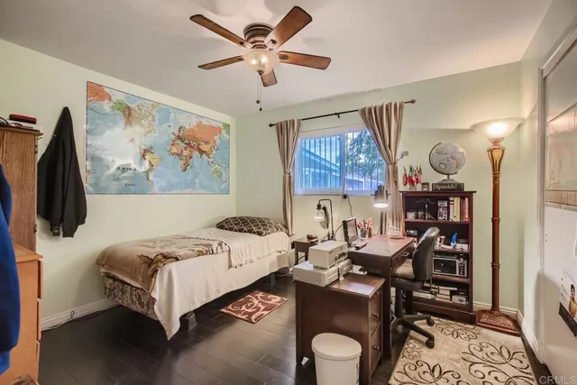 a living room with a bed furniture and a window