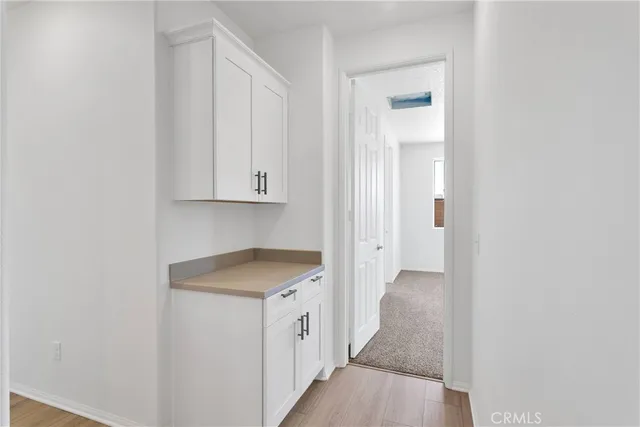 a bathroom with a sink vanity and a mirror