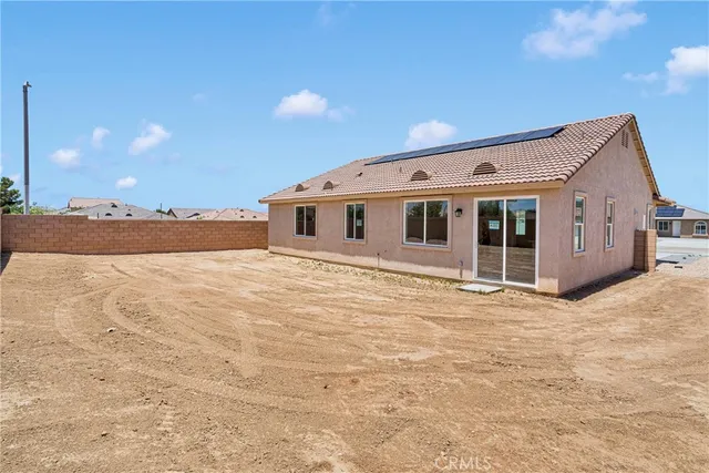 a front view of a house with a outdoor space